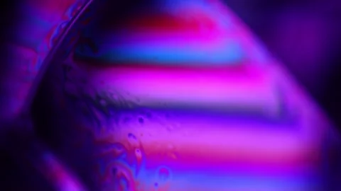 Purple multi-colored liquid in macro, color change and reflection Stock Footage 279485593