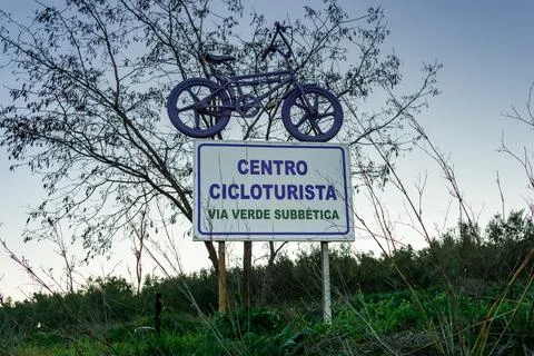 Purple old style BMX bicycle over a sign Stock Photos
