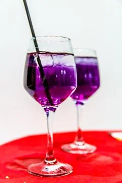 Purple or blue cocktail poured into the glass. Stock Photos
