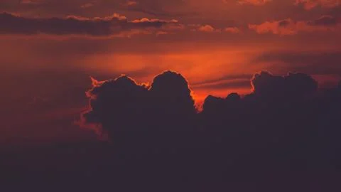 Purple orange sunset clouds Stock Photos