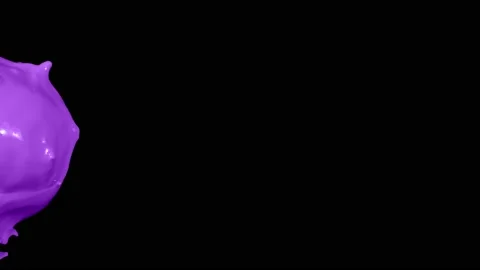 Purple paint splash thrown in slow motion, liquid isolated on black (4K) Stock Footage 137111493