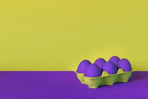 Purple painted Easter eggs in yellow wrapping on purple and yellow background Stock Photos