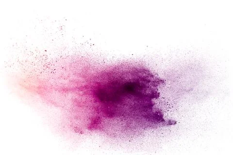 Purple particles explosion on white background. Freeze motion of purple dust Stock Photos