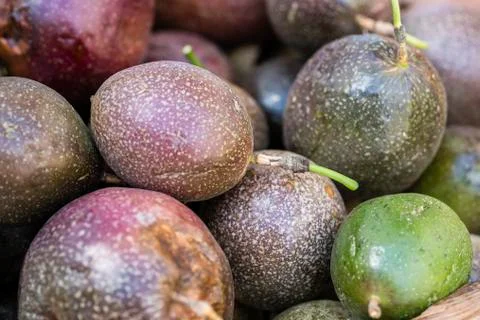 Purple passion fruit background, closeup. Stock Photos