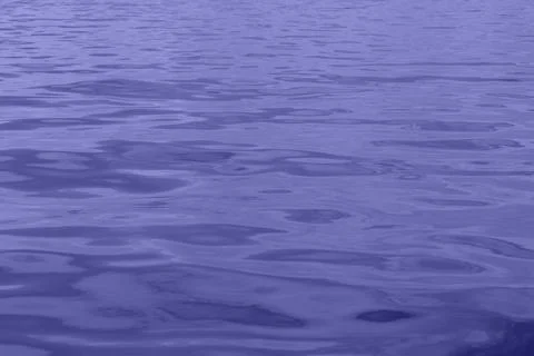 Purple pattern of water waves Stock Photos