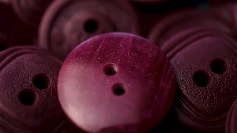 Purple plastic sew buttons rotates on bl... | Stock Video | Pond5