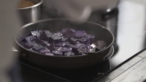 Purple potatoes in a pan Stock Footage 82022643