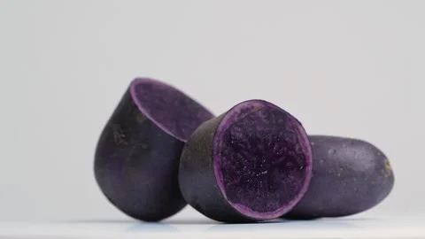 Purple Potatoes in a studio shot 스톡 동영상 249930446