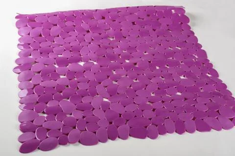 Purple rubber mat for bath with pattern as background, imitation of stone Photos