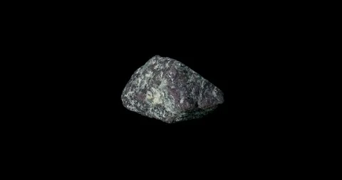 Purple Ruby Mineral Turning on Black Stockbeeldmateriaal 111037978
