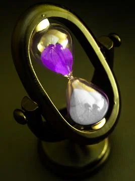 Purple sand clock  Stock Photos