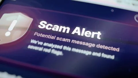 Purple scam alert with shield icon Stock Photos