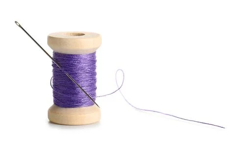Purple sewing thread with needle on white background Stock Photos