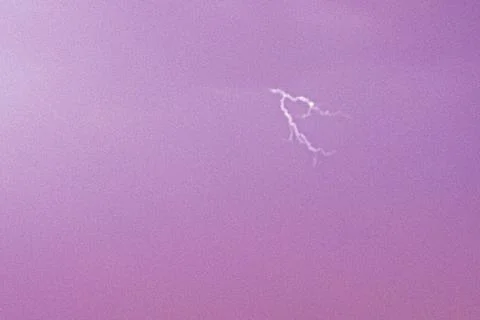 Purple sky with clouds at sunset during a thunderstorm with lightning Foto stock