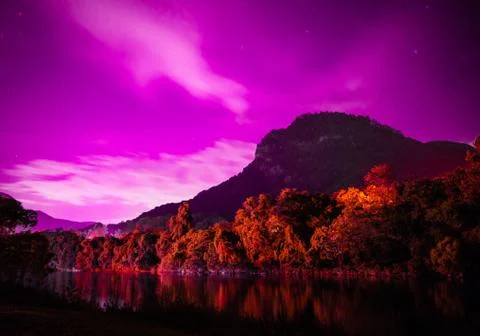Purple sky mountain lake Stock Photos