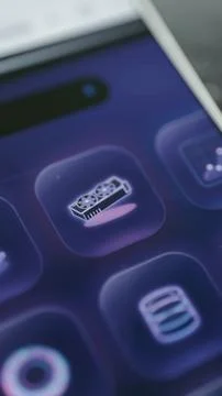 Purple smartphone control panel displays a detailed dual fan graphics card Stock Photos