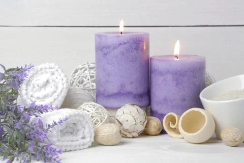 Purple spa setting with burning candles and potpourri. Spa still life Stock Photos