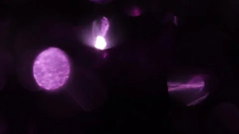 Purple sparkling bokeh light effect scattered in the black Stockbeeldmateriaal 318946297