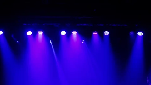 Purple stage lights move and change effects in slow motion creating atmosph.. Stock Footage 330307150