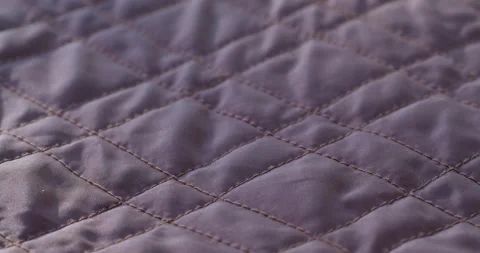 Purple stitched fabric close-up. Macro shooting of soft and warm waterproof Stock Footage 167902077