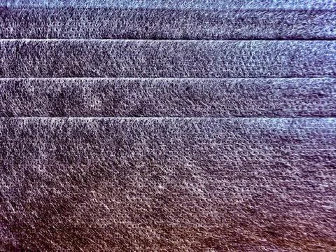 Purple stone steps macro closeup reveals intricate rugged layered porous surf Stock Photos
