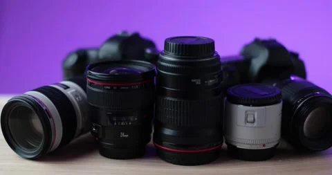 Purple studio background camera alongside filming equipment high quality footage Stock Footage 237546740