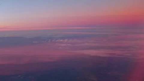 Purple sunset from a from plane window Stock Footage 148990468