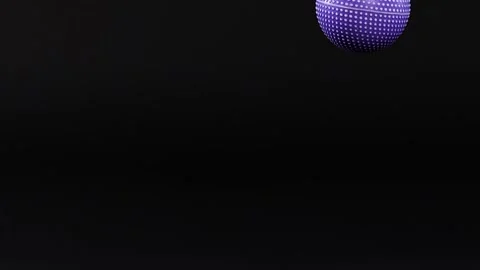 Purple Textured Ball Bouncing Against a Solid Black Background Stock Footage 326081027