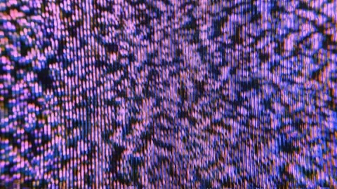 Purple violet pixel burst on CRT screen, colorful analog glitch macro close-up Stock Footage 341699158