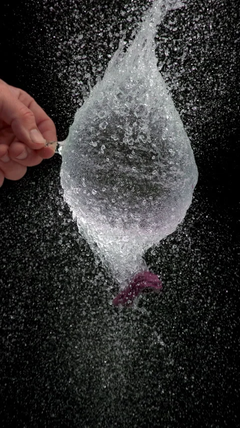 Purple Water Balloon Explodes After Needle Puncture 스톡 동영상 314303417