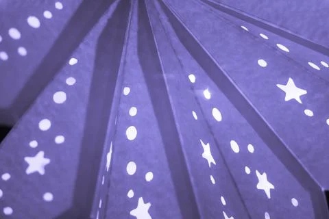 Purple xmas lantern star pattern at christmas market season. Shiny star mood  Stock Photos