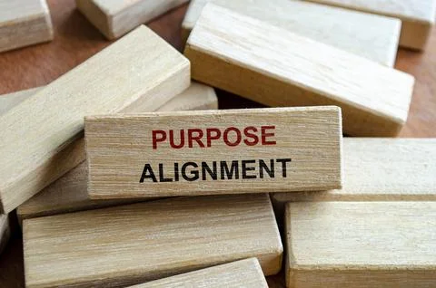 Purpose alignment text written on wooden blocks symbolizing synchronization.. Stock Photos
