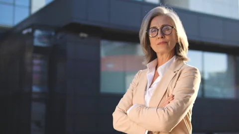 Purposeful assertive lady in stylish business suit looking at camera, outdoor Stock Footage 144900576