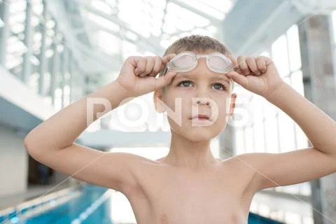 Purposeful boy dreaming of success in swimming contest Stock Photos