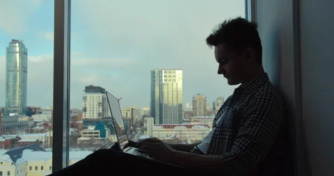 Purposeful man works against the background of modern buildings Stock-Footage 151379331