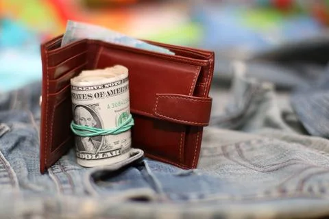 Purse bundle of dollars Stock Photos
