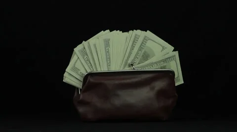 Purse with dollars on a white background revolves loop Stock Footage 34660769