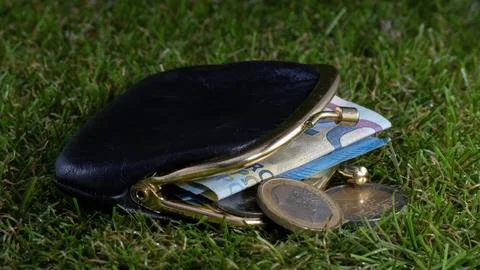 Purse lost on the floor Stock Photos