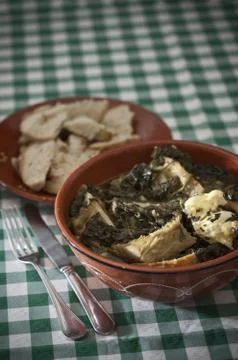 Purslane soup with codfish Stock Photos