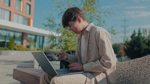 The Pursuit of Knowledge Asian Korean Student Engaged in Outdoor Study Stock Footage 252540698