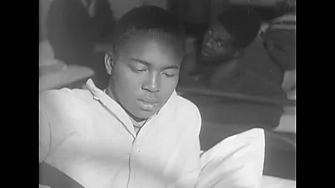 PUSAN - 1950 - Doctors perform surgery on a wounded soldier's leg at the 8054th Stock-Footage 280165515