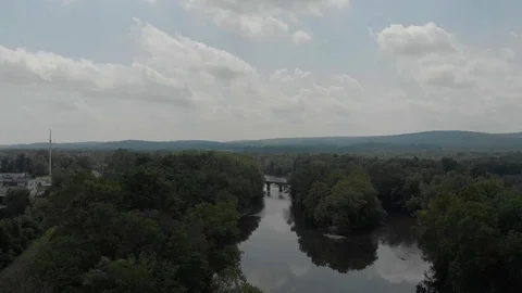 Push-In Aerial Flight Over River, Bridge, Mountains and Clouds in Northeast US Stock Footage 113877160