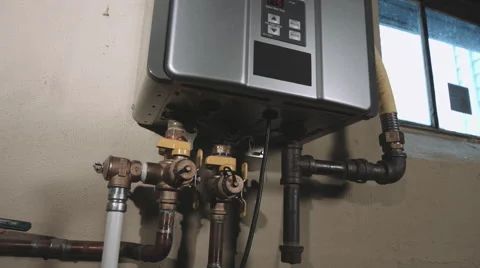 Push In and Back on Low Angle Closeup of Tankless Water Heater Stock Footage 61710433