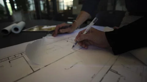 A push in on architects drawing Stock Footage 155537063