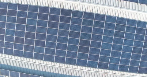 Push Back Orbit Shot Of Solar Panels On Factory Roof Stock Footage 142870505