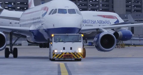 Push back vehicle towing plane Stock Footage 114037217