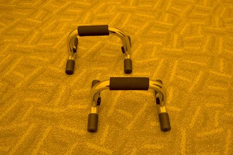 Push up bars on the carpet Stock Photos