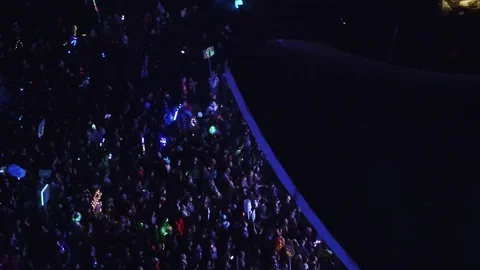 Push from behind stage to front looking at crowd - NIGHT Video stock 78389831