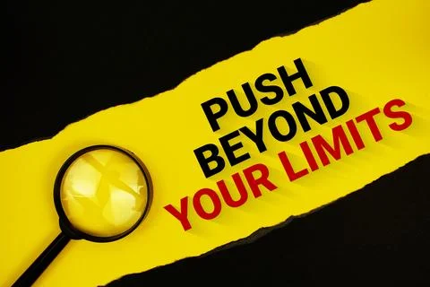 Push Beyond Your Limits text on yellow with black paper torn ripped and mag.. Stock Photos