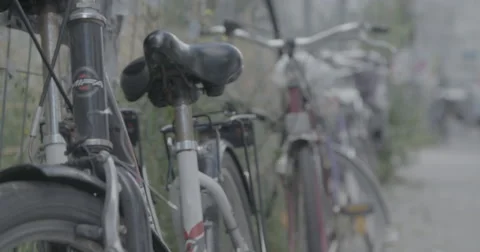 Push Bikes chained up in Berlin, Germany - 4K Stock Footage 68497242